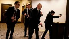 In pictures: Chaos as gunfire heard in Washington DC ballroom